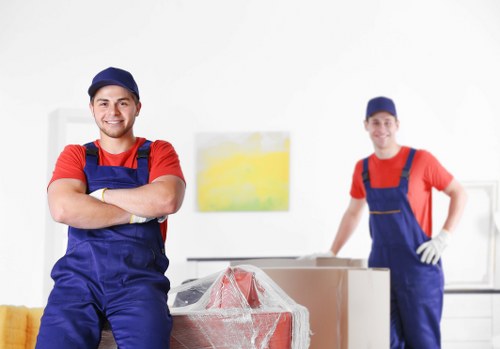 Careful box packing for fragile household items in Bow