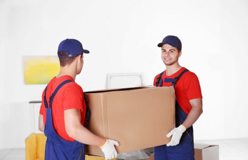 Office relocation planning in Bow with furniture and boxes ready for transport