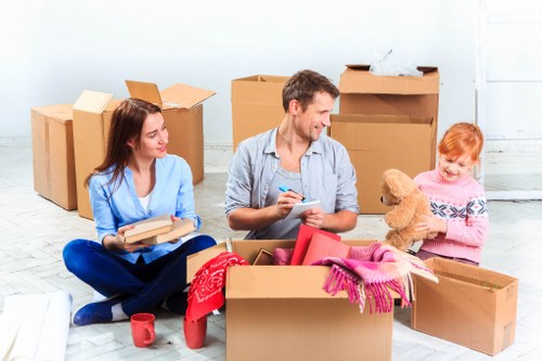 Careful furniture handling during a Bow van removal job