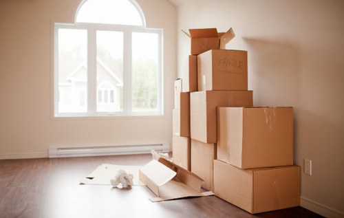 Removalists loading household items for a Bow property move