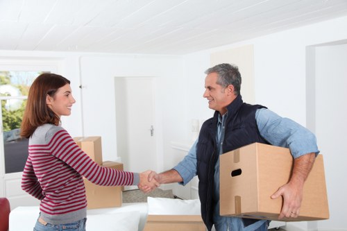Loading furniture into a removal truck for a Bow home relocation