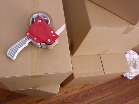 Furniture and boxes organised for removal truck hire in Bow