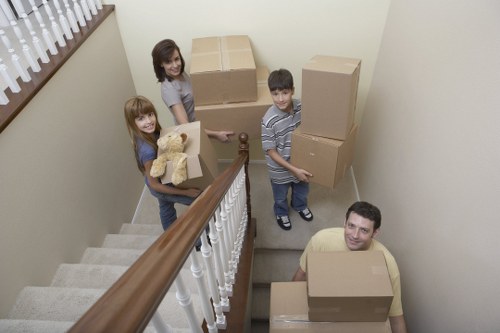 Team moving furniture from a flat in Bow with care